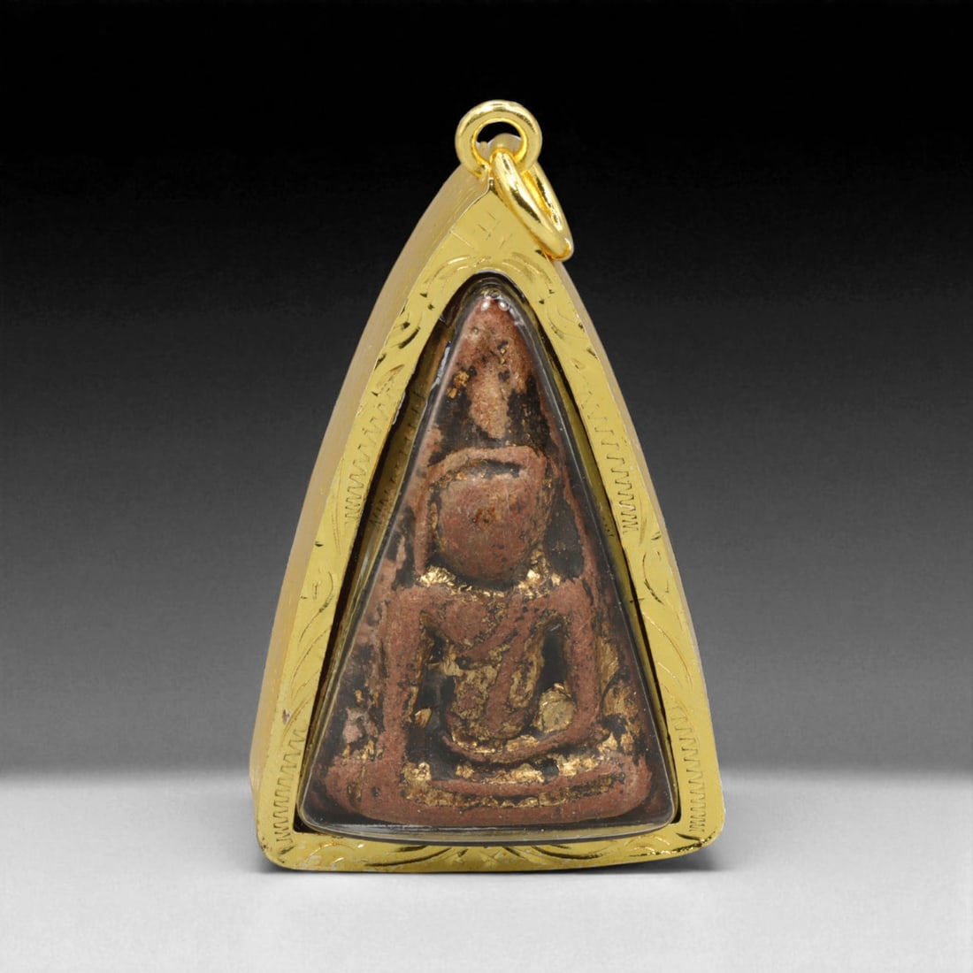 Thai Temple Gilt Buddhist Amulet in Ornate Gold-Tone Frame, 4.5cm: This beautifully crafted gilt Buddhist amulet is enclosed within an intricately designed gold-tone frame, combining sacred symbolism with refined artistry. The detailed relief and lustrous finish refl