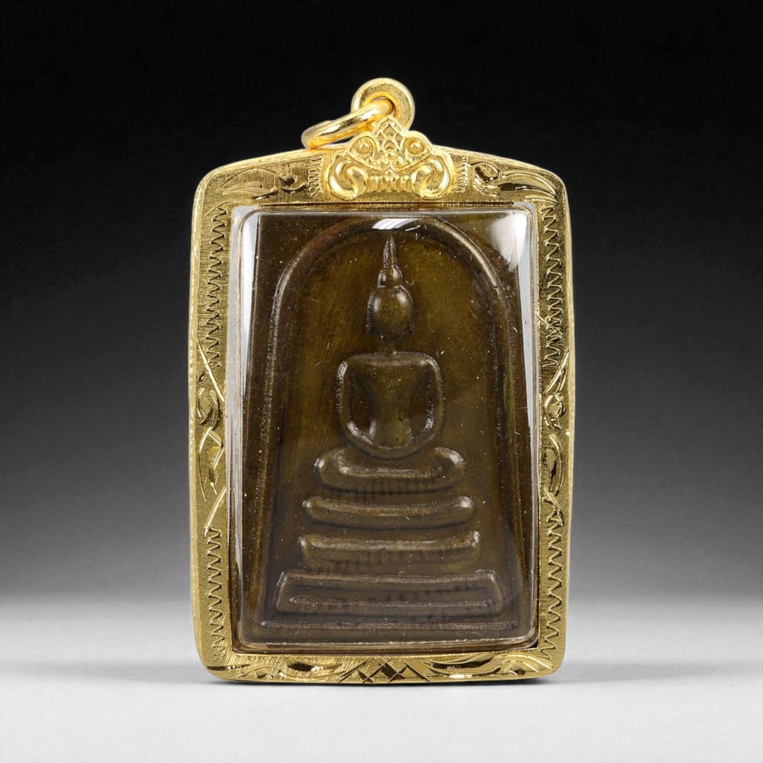 Thai Temple Style Gilt Buddhist Amulet in Ornate Gold-Tone Frame, 5cm: This beautifully crafted gilt Buddhist amulet is enclosed within an intricately designed gold-tone frame, combining sacred symbolism with refined artistry. The detailed relief and lustrous finish refl