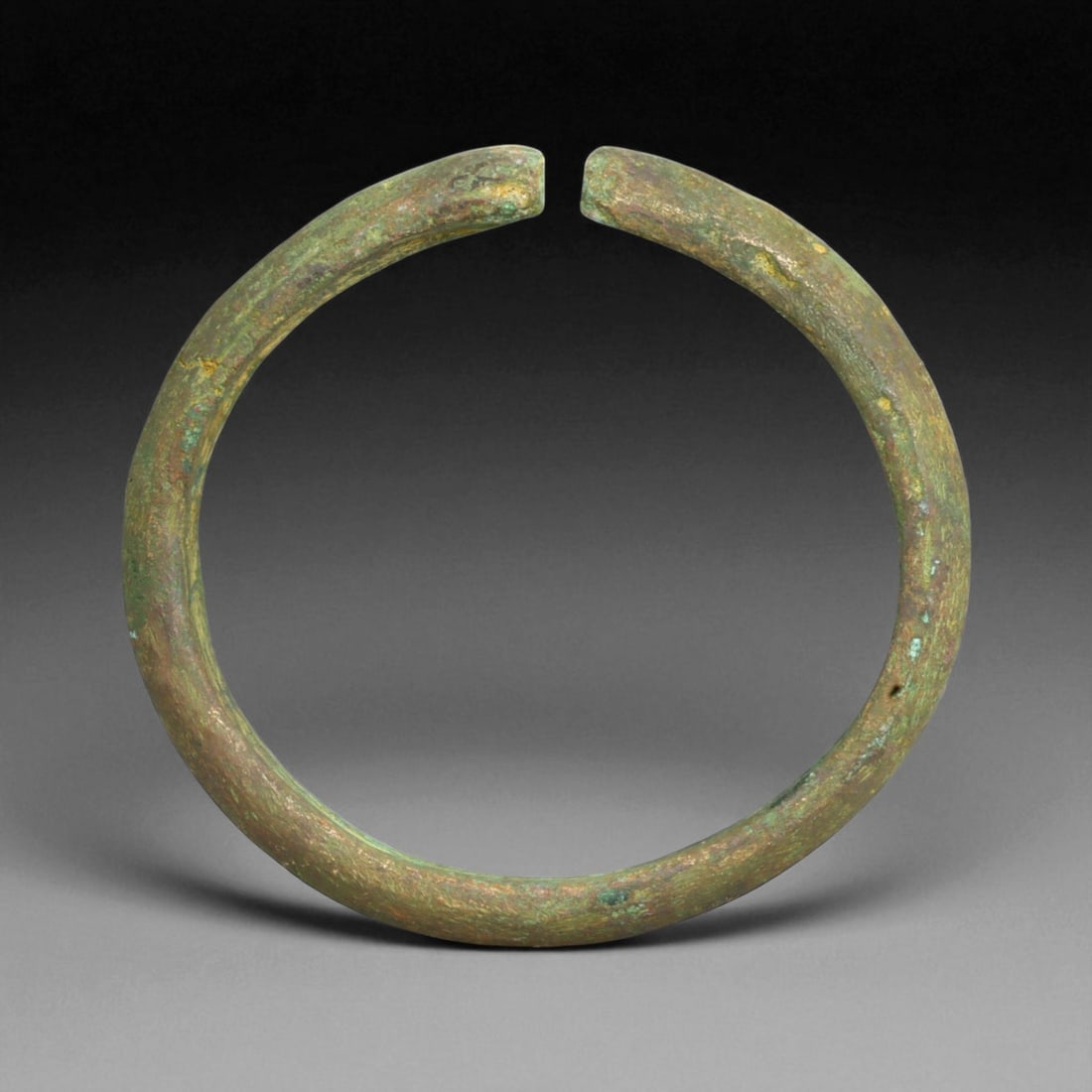 Ancient Roman Bronze Bracelet, c. 1st-3rd Century CE, 8cm, 96g: This ancient Roman bronze bracelet dates to the height of the Roman Empire, between the 1st and 3rd centuries CE, a time of expansive trade, engineering marvels, and refined metal craftsmanship. Bronz