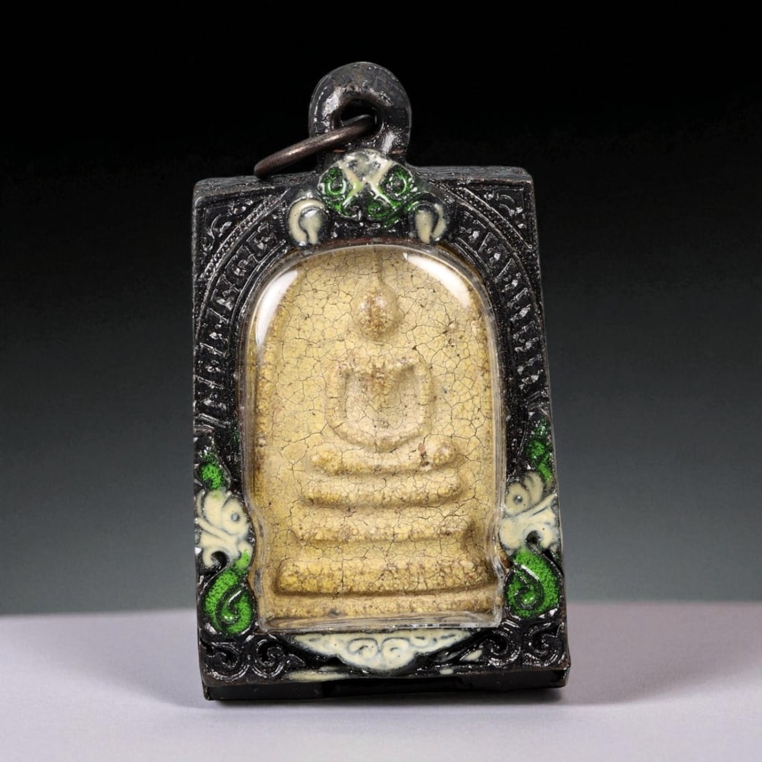 Vintage Thai Buddhist Amulet in Ornate Framed Setting, 20th Century, 6cm: This vintage Thai Buddhist amulet exemplifies the devotional artistry that continues to define Thailand's sacred craftsmanship. Encased within an intricately detailed frame, the amulet displays refine
