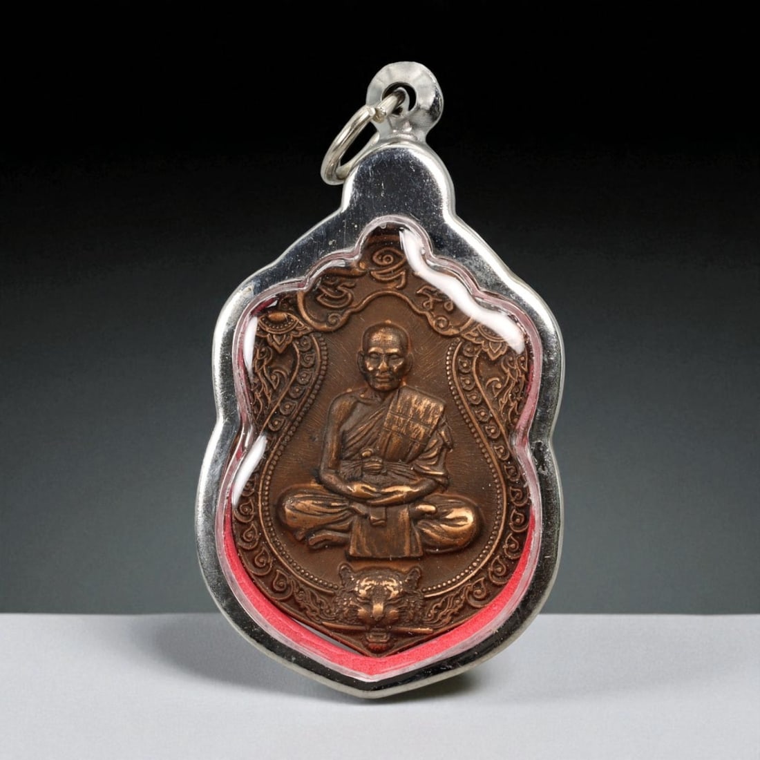Vintage Thai Buddhist Amulet in Ornate Framed Setting, 20th Century, 6cm: This vintage Thai Buddhist amulet exemplifies the devotional artistry that continues to define Thailand's sacred craftsmanship. Encased within an intricately detailed frame, the amulet displays refine