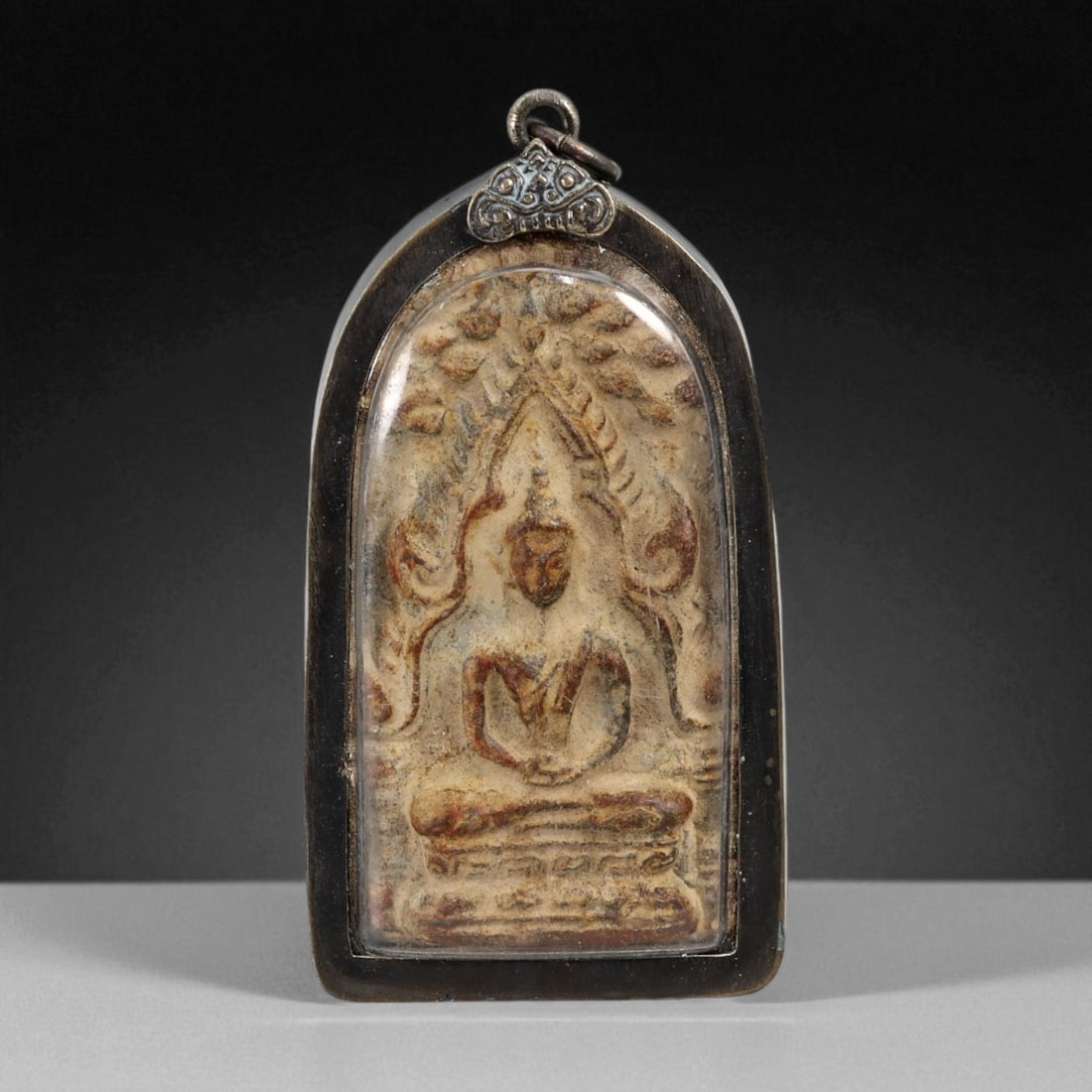 Vintage Thai Buddhist Amulet in Ornate Framed Setting, 20th Century, 6.5cm: This vintage Thai Buddhist amulet exemplifies the devotional artistry that continues to define Thailand's sacred craftsmanship. Encased within an intricately detailed frame, the amulet displays refine
