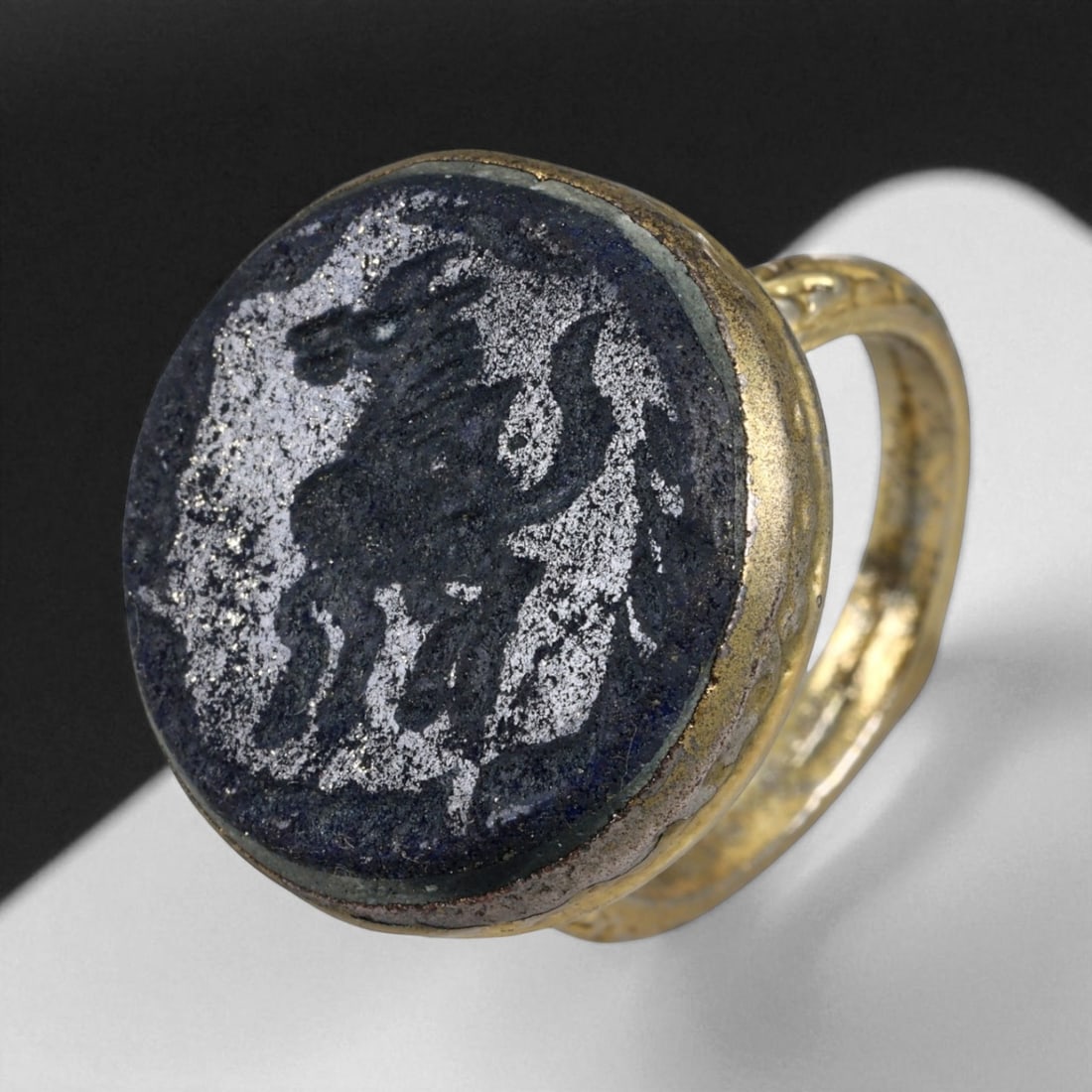 Antique Qajar Gold Gilt Intaglio Signet Ring, c. 19th-20th Century, 8.5 US, 17g: This substantial gilt ring, dating to the Qajar era of the 19th-20th century, embodies the regal aesthetic and cultural refinement of Persian jewelry traditions. The bezel is set with an engraved inta