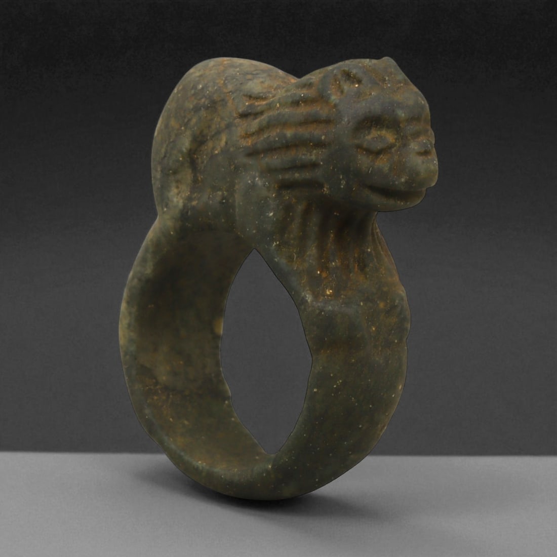 Ancient Parthian Lion-Form Steatite Ring, c. 2nd-1st Century BCE, 4.1 cm: This striking ring, carved from dense steatite and shaped into the form of a prowling lion, dates to the Parthian Empire-an era that bridged Hellenistic refinement and Persian grandeur. The Parthians,