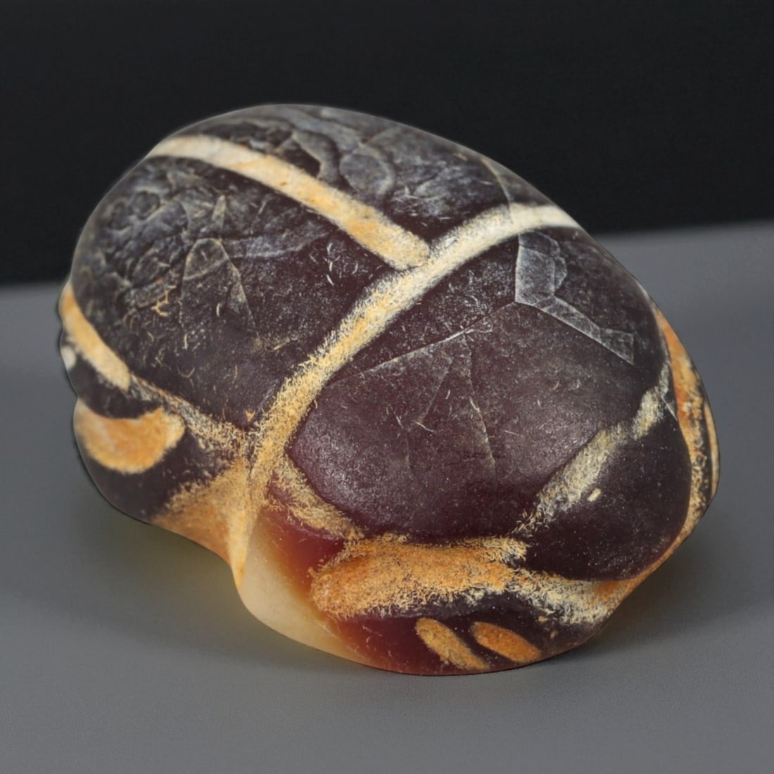 Ancient Egyptian Banded Agate Scarab Amulet, c. New Kingdom 16th-11th Century BCE (2.1 cm): This beautifully carved scarab amulet, fashioned from rich banded agate, dates to Egypt's New Kingdom period-a time when scarabs served as enduring emblems of protection, transformation, and rebirth. 