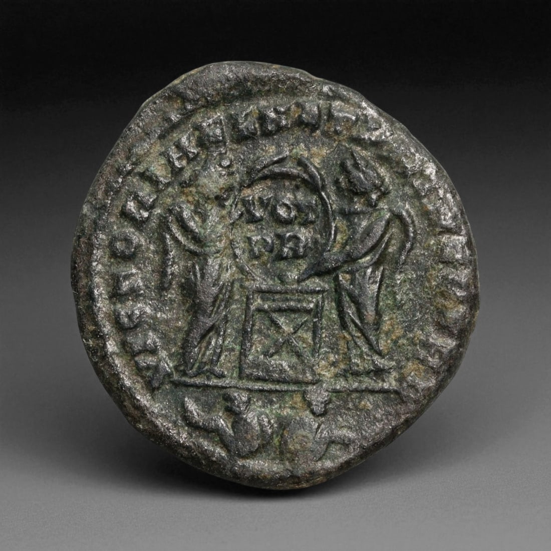 ROMAN EMPIRE: Imperial Authority - Bronze Coin, c. 1st-3rd Century AD, 18mm: Struck during the turbulent decades of the later Roman Empire, this 19mm bronze coin reflects the enduring symbolism of imperial control amidst crisis. Its compact yet deliberate design likely feature