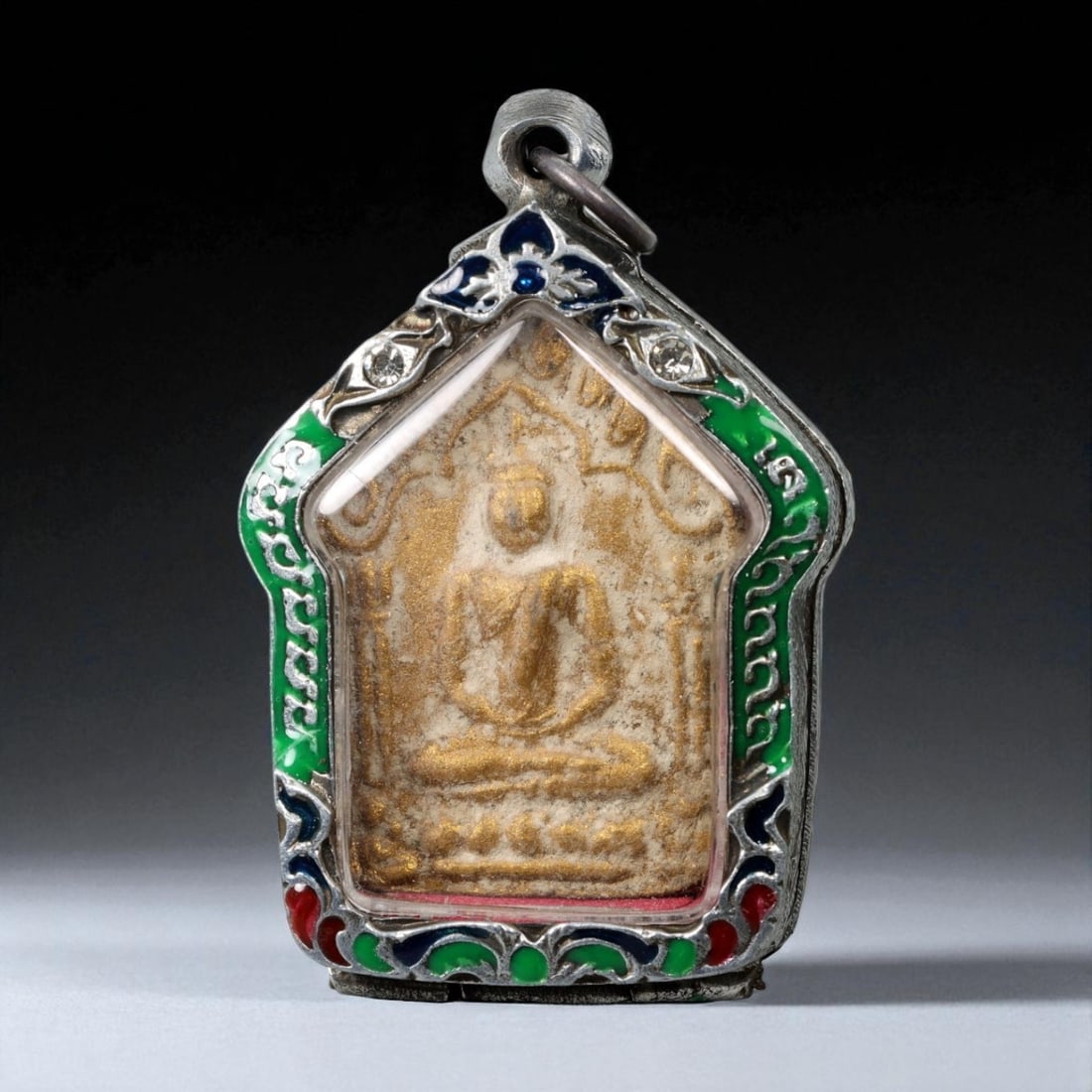 Vintage Thai Buddhist Amulet in Ornate Framed Setting, 20th Century, 6cm: This vintage Thai Buddhist amulet exemplifies the devotional artistry that continues to define Thailand's sacred craftsmanship. Encased within an intricately detailed frame, the amulet displays refine
