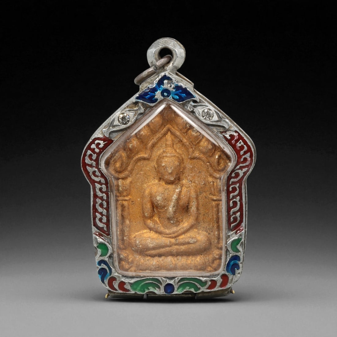 Vintage Thai Buddhist Amulet in Ornate Framed Setting, 20th Century , 5.5cm: This vintage Thai Buddhist amulet exemplifies the devotional artistry that continues to define Thailand's sacred craftsmanship. Encased within an intricately detailed frame, the amulet displays refine