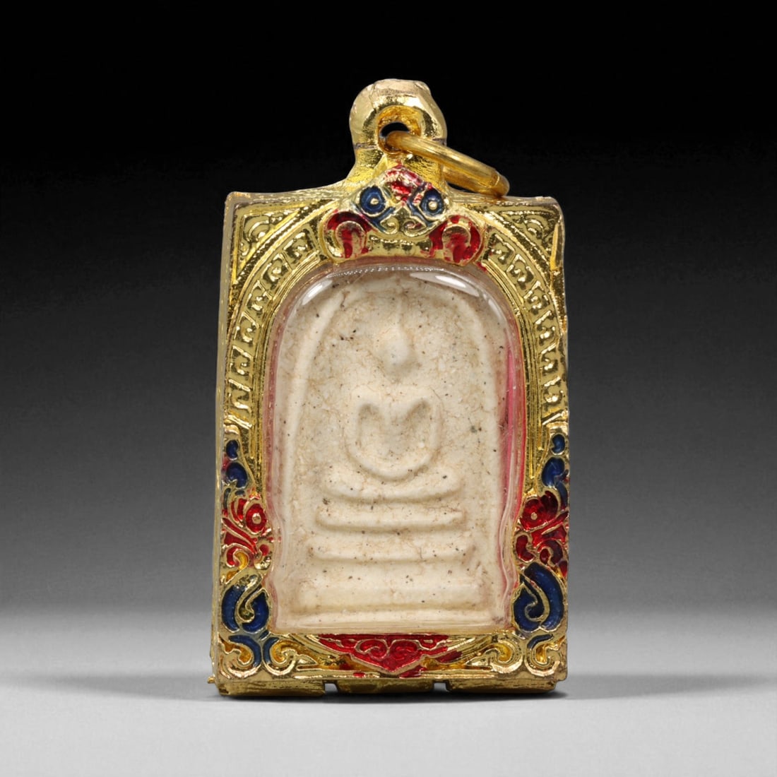 Thai Temple Style Gilt Buddhist Amulet in Ornate Gold-Tone Frame, 5cm: This beautifully crafted gilt Buddhist amulet is enclosed within an intricately designed gold-tone frame, combining sacred symbolism with refined artistry. The detailed relief and lustrous finish refl