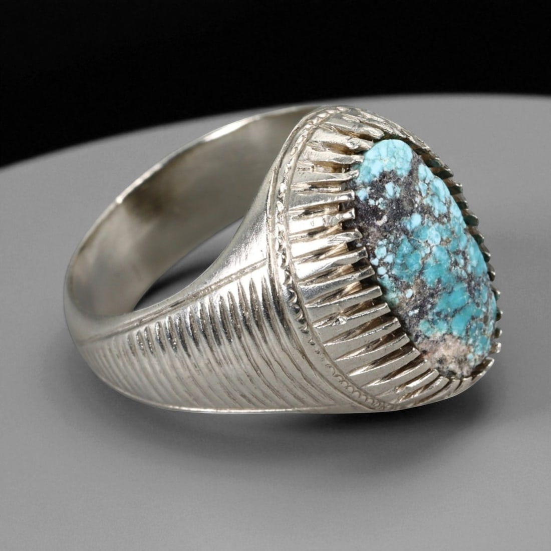 Antique Persian Style Turquoise Matrix Silver Ring, c. 19th-20th Century, US Size 9: This elegant antique silver ring reflects the refined aesthetic of late Qajar to early Pahlavi Persian jewelry, where clean geometry met enduring symbolism. At its center, an elongated oval turquoise 
