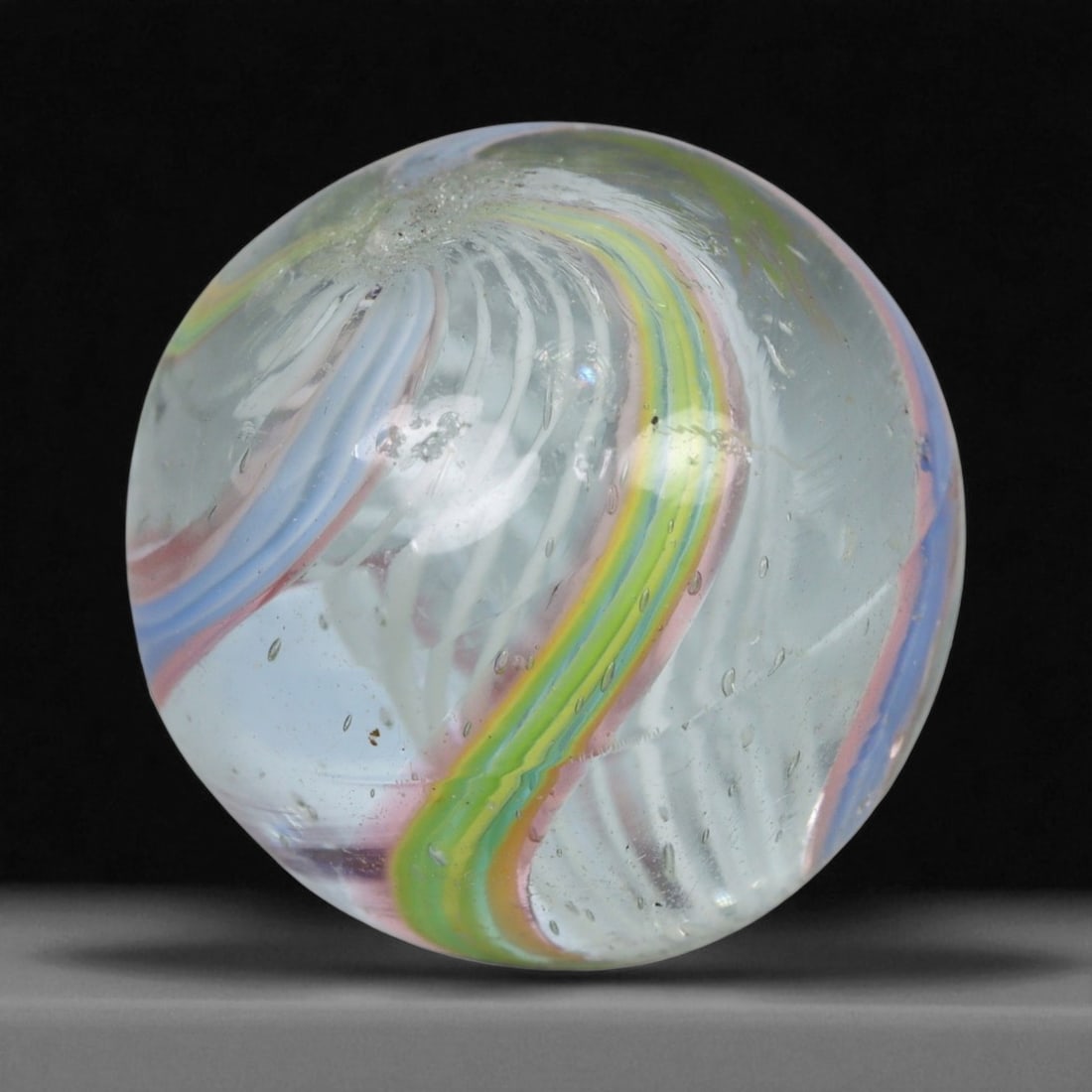 Vintage German Handmade Glass Swirl Marble, c. Early-Mid 20th Century, 16 mm: This vintage German handmade glass marble represents the golden era of European glass artistry, where precision craftsmanship and vibrant color blending elevated even simple play objects into collecti