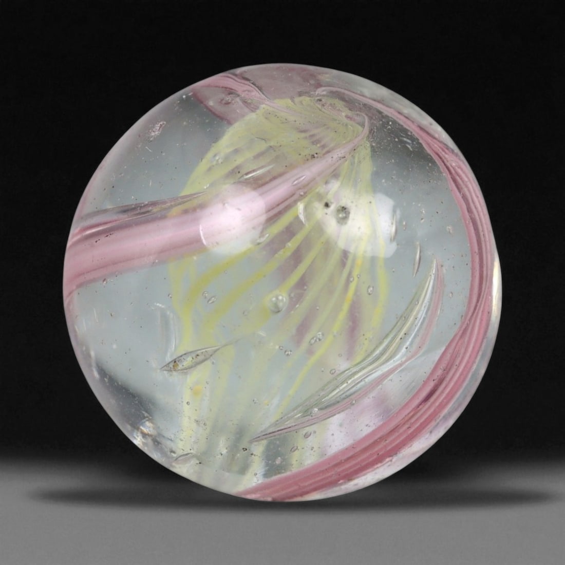 Vintage German Handmade Glass Swirl Marble, c. Early-Mid 20th Century, 15 mm: This vintage German handmade glass marble represents the golden era of European glass artistry, where precision craftsmanship and vibrant color blending elevated even simple play objects into collecti