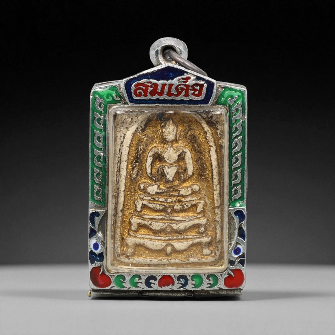 Vintage Thai Buddhist Amulet in Ornate Framed Setting, 20th Century , 5.5cm: This vintage Thai Buddhist amulet exemplifies the devotional artistry that continues to define Thailand's sacred craftsmanship. Encased within an intricately detailed frame, the amulet displays refine