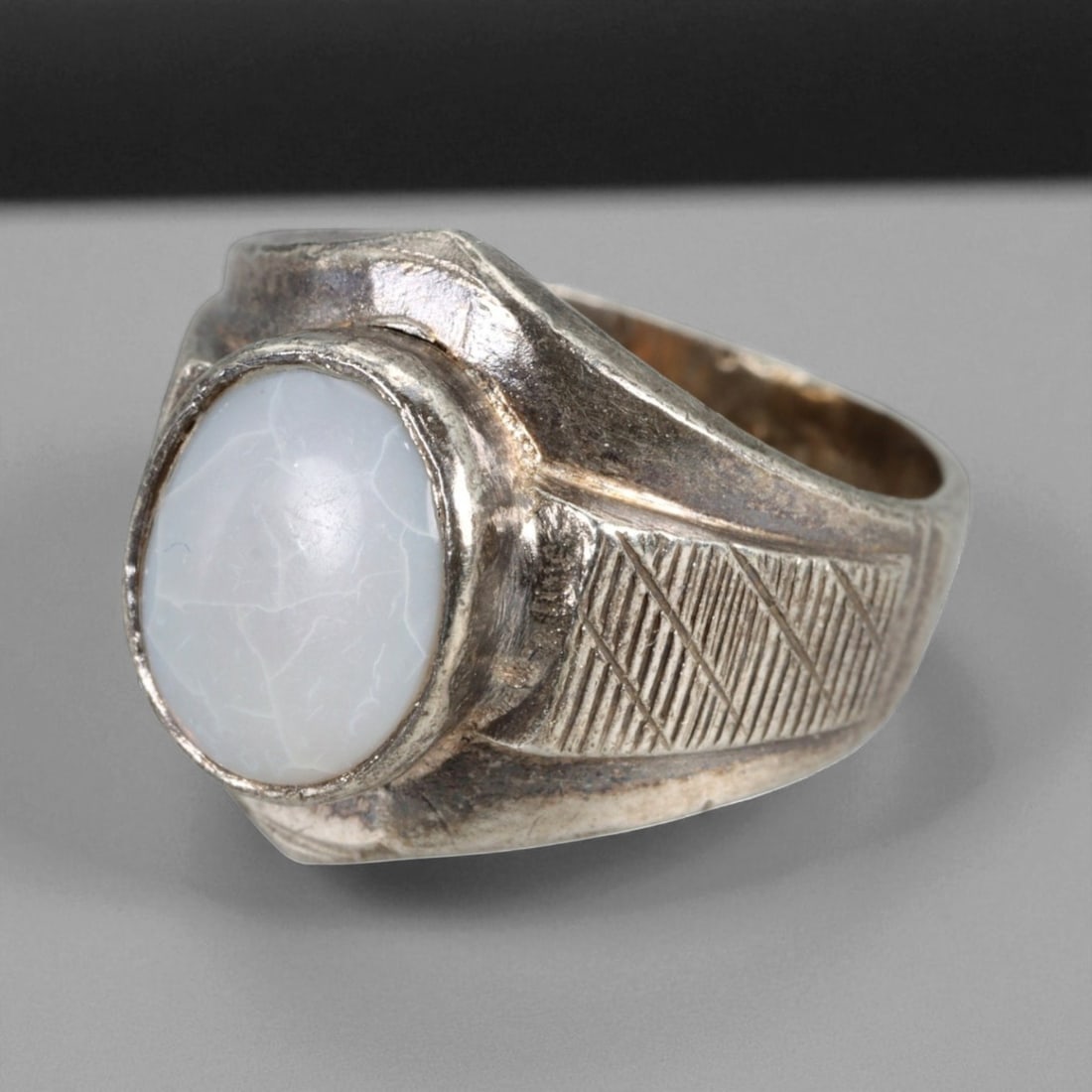 Antique Persian White Chalcedony Silver Ring, c. 19th-20th Century, US Size 8: This refined antique Persian ring from the late 19th to early 20th century features a luminous white chalcedony gemstone, beautifully mounted in a sculpted silver setting. The gem's soft translucence 