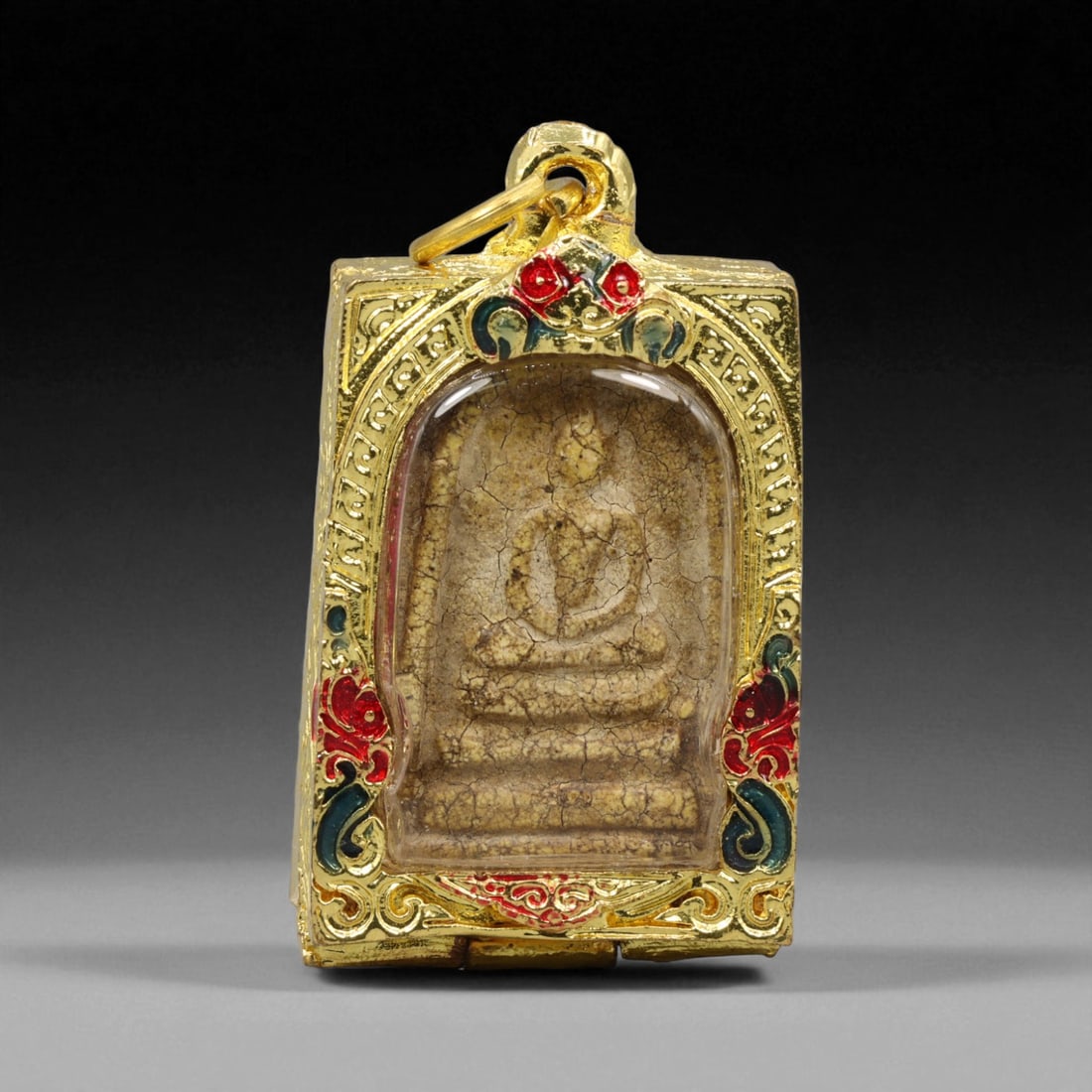 Thai Temple Style Gilt Buddhist Amulet in Ornate Gold-Tone Frame, 5cm: This beautifully crafted gilt Buddhist amulet is enclosed within an intricately designed gold-tone frame, combining sacred symbolism with refined artistry. The detailed relief and lustrous finish refl