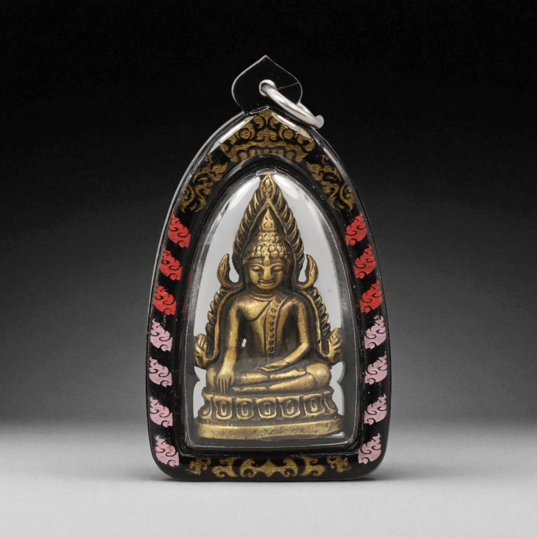 Thai Buddhist Amulet in Acrylic Casing with Gilt Relief , 6cm: This finely detailed Thai Buddhist amulet presents a striking balance between modern craftsmanship and sacred symbolism. Set within a clear acrylic casing that enhances its brilliance and preserves it