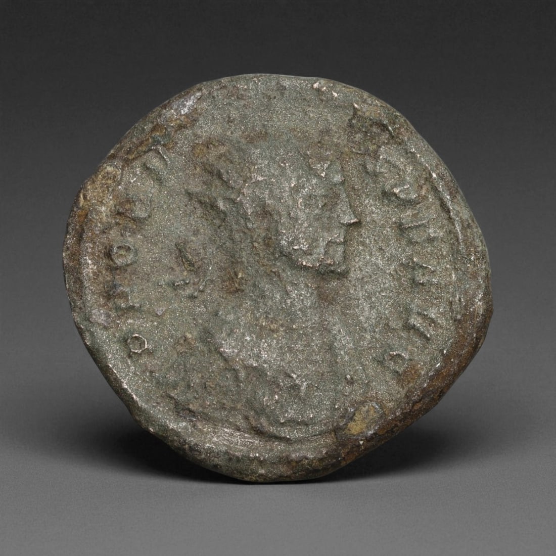 ROMAN EMPIRE: Imperial Authority - Bronze Coin, c. 1st-3rd Century AD, 22mm: Struck during the turbulent decades of the later Roman Empire, this 19mm bronze coin reflects the enduring symbolism of imperial control amidst crisis. Its compact yet deliberate design likely feature