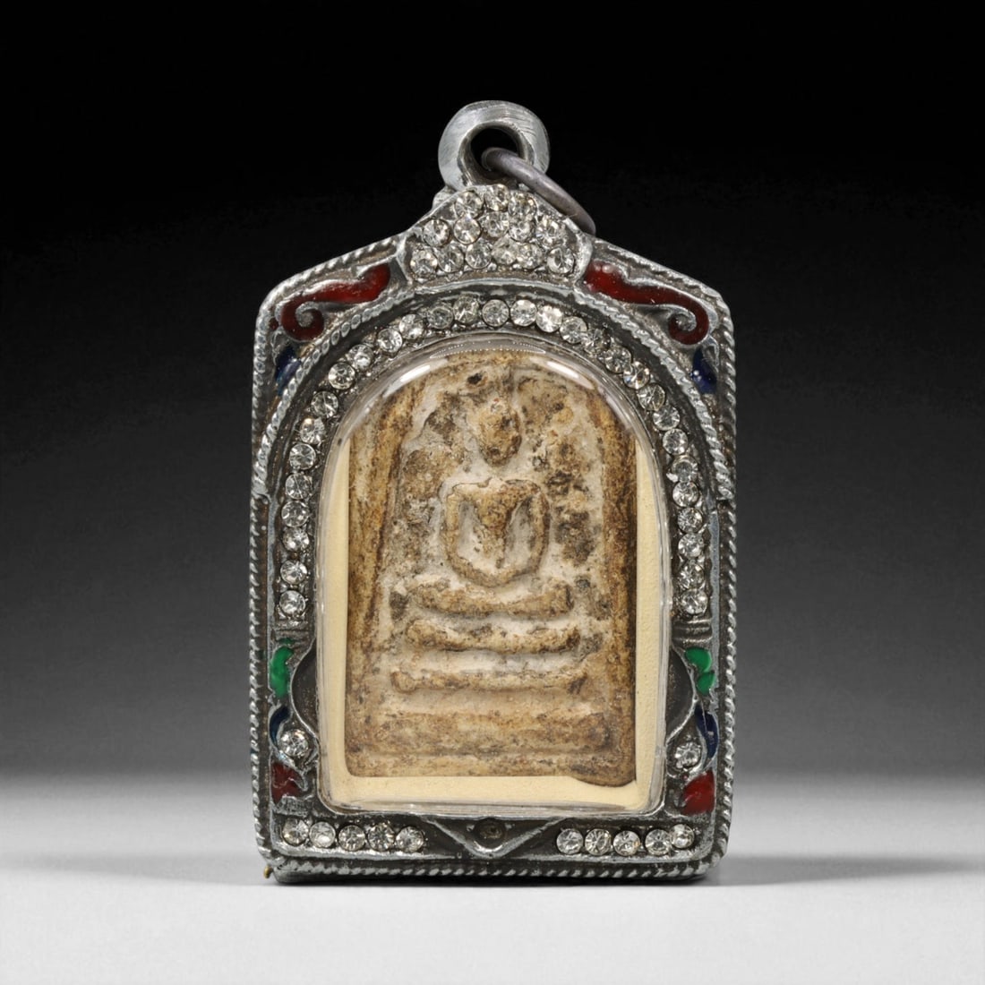 Vintage Thai Buddhist Amulet in Ornate Framed Setting, 20th Century , 5.5cm: This vintage Thai Buddhist amulet exemplifies the devotional artistry that continues to define Thailand's sacred craftsmanship. Encased within an intricately detailed frame, the amulet displays refine