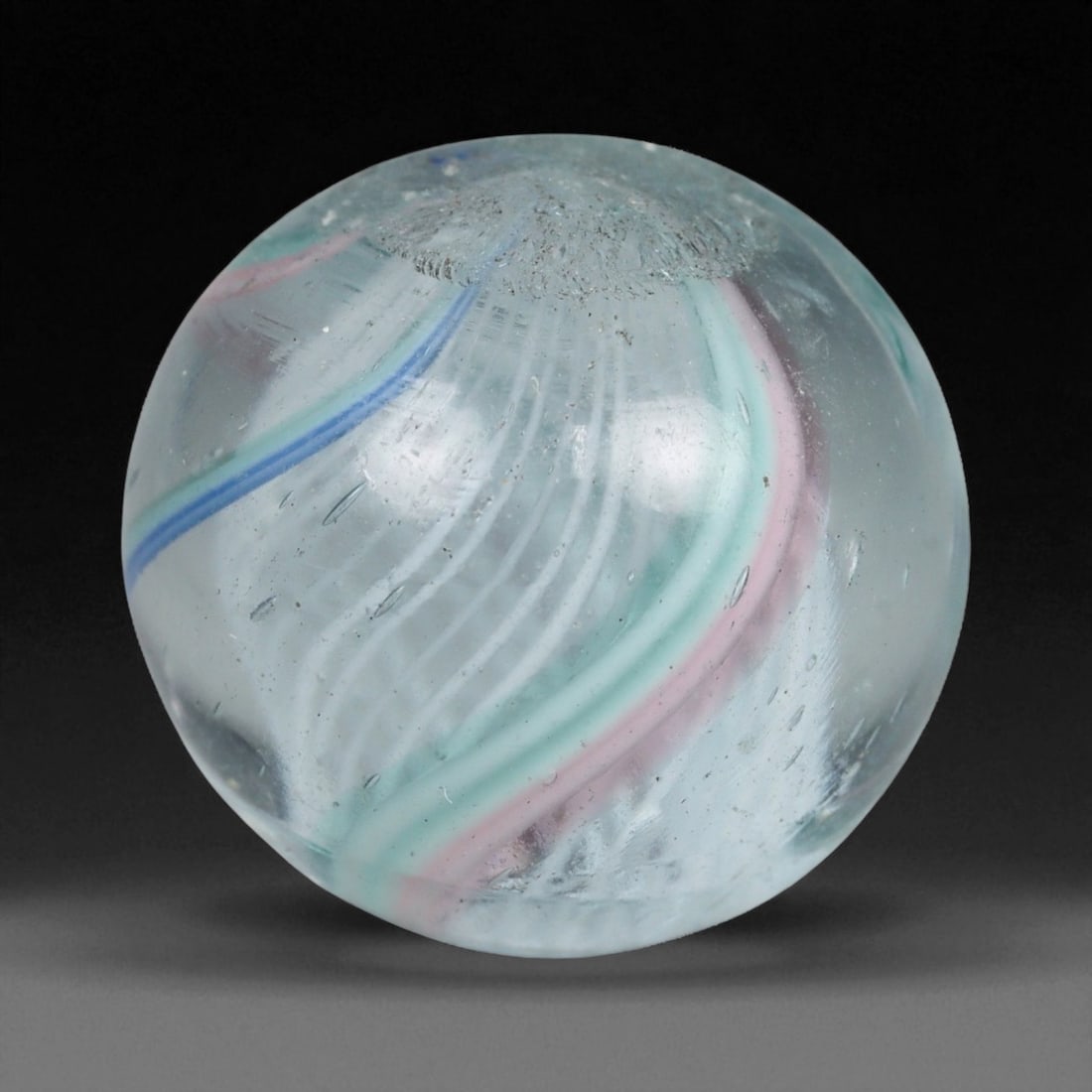 Vintage German Handmade Glass Swirl Marble, c. Early-Mid 20th Century, 15 mm: This vintage German handmade glass marble represents the golden era of European glass artistry, where precision craftsmanship and vibrant color blending elevated even simple play objects into collecti