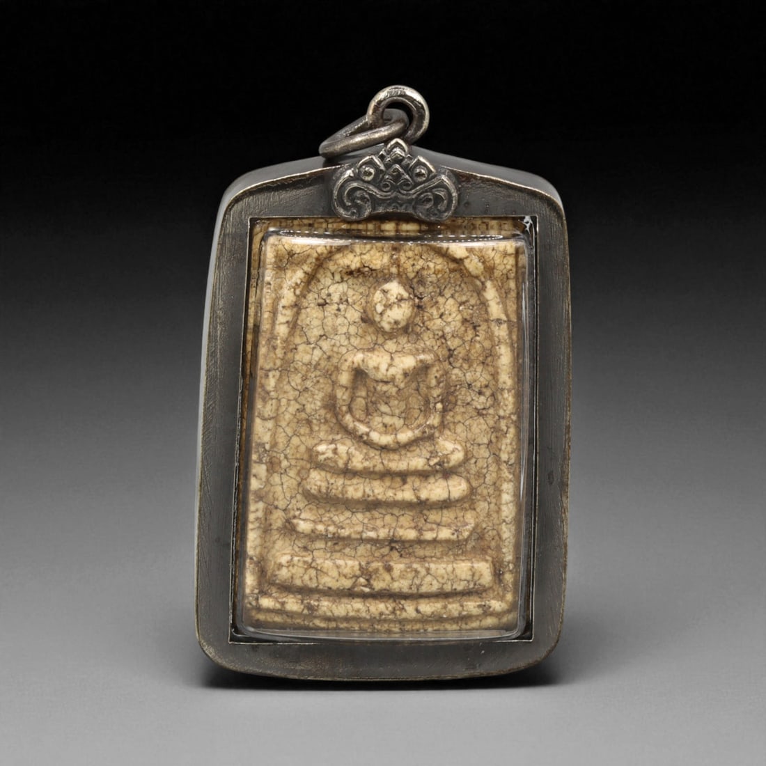 Vintage Thai Buddhist Amulet in Ornate Framed Setting, 20th Century , 4.5cm: This vintage Thai Buddhist amulet exemplifies the devotional artistry that continues to define Thailand's sacred craftsmanship. Encased within an intricately detailed frame, the amulet displays refine