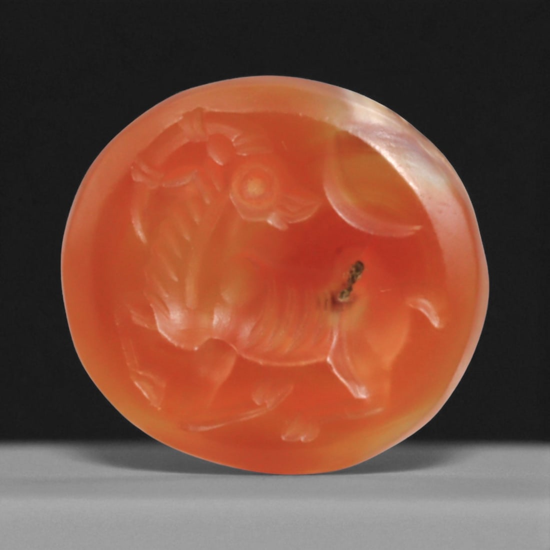Ancient Sasanian Carnelian Intaglio with Engraving Motif, 1.7cm, 2g: This carnelian intaglio, finely engraved into the warm red tones of semi-precious stone, reflects a tradition of craftsmanship spanning from the classical world to the early modern era. Intaglios serv