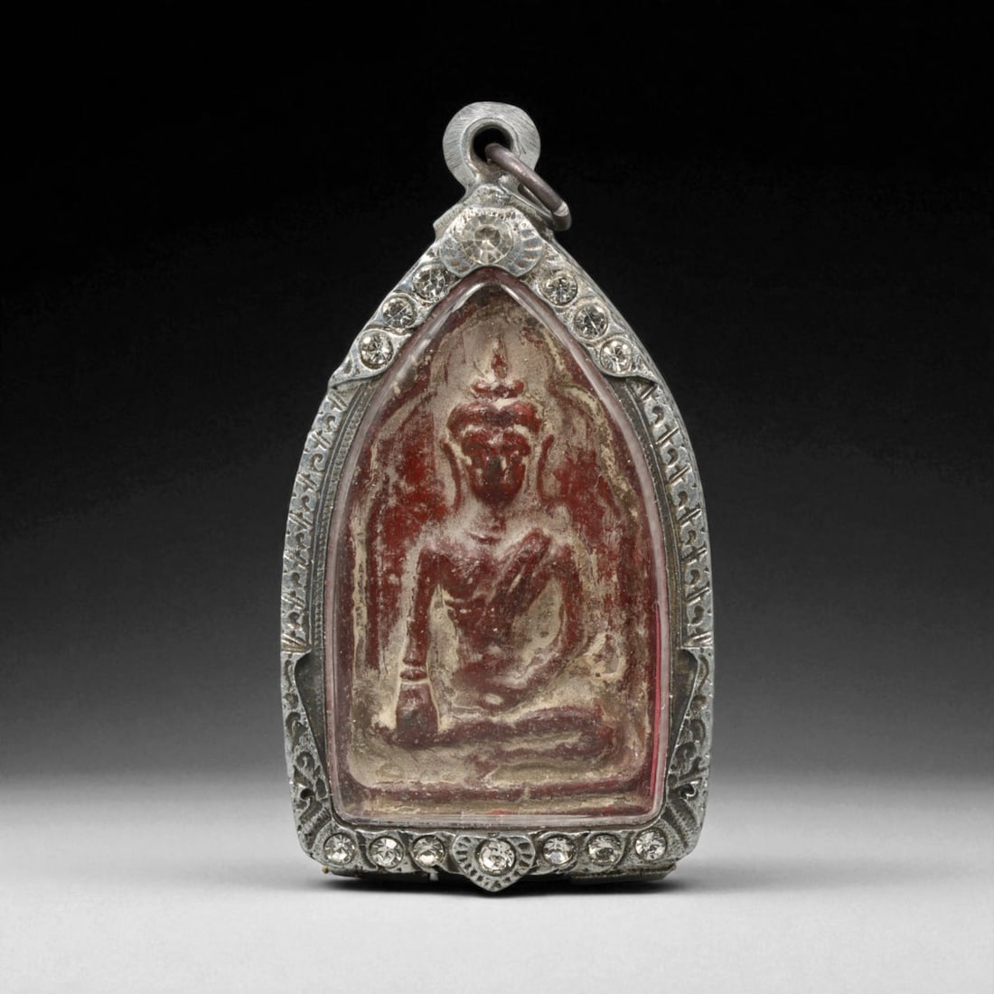 Vintage Thai Buddhist Amulet in Ornate Framed Setting, 20th Century , 6.5cm: This vintage Thai Buddhist amulet exemplifies the devotional artistry that continues to define Thailand's sacred craftsmanship. Encased within an intricately detailed frame, the amulet displays refine