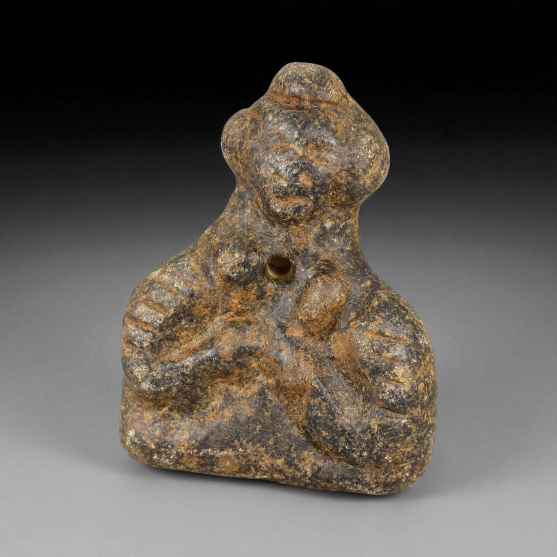 Ancient Akkadian Anthropomorphic Basalt Amulet, c. 2300-2100 BCE, 4cm: This small yet profoundly evocative basalt amulet dates to the Akkadian Empire, one of the earliest great Mesopotamian powers that flourished around the late 3rd millennium BCE. Carved from dense, dar