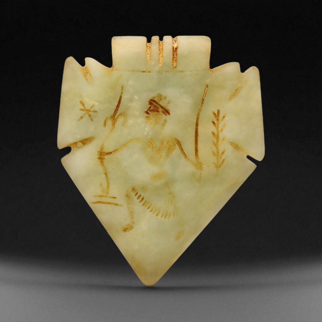 Ancient Neo-Assyrian Greenstone Archer Amulet Pendant, c. 9th-7th Century BCE, 6cm: This remarkable greenstone amulet pendant originates from the Neo-Assyrian Empire, a period that marked the zenith of Mesopotamian power and artistic sophistication. Carved in bold relief, the piece d