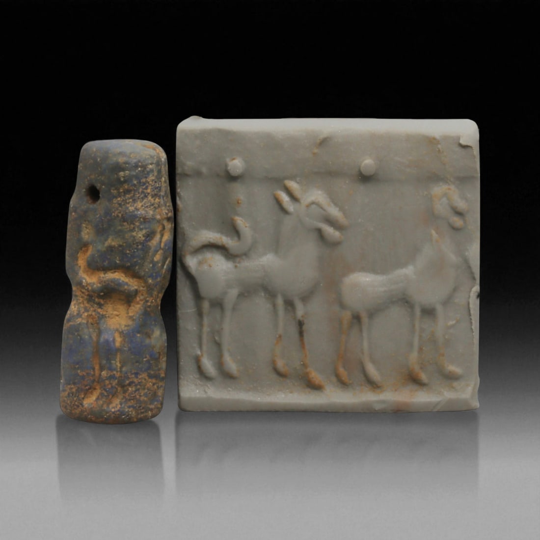 Ancient Akkadian Lapis Lazuli Cylinder Seal, c. 2334-2154 BCE, 2.3cm: This exceptional cylinder seal, carved from prized lapis lazuli, dates to the Akkadian Empire of Mesopotamia (c. 2334-2154 BCE). The seal is engraved with finely executed imagery, which when rolled on