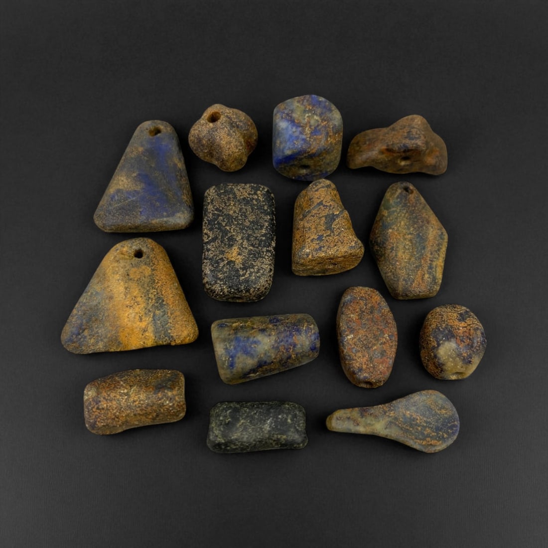 Ancient Bactrian Lapis Lazuli Beads, c. 2nd Millennium BCE, 1-2cm: These ancient lapis lazuli beads originate from the region once known as Bactria, located in present-day northern Afghanistan - a civilization renowned for its early mastery of gemstone craftsmanship 