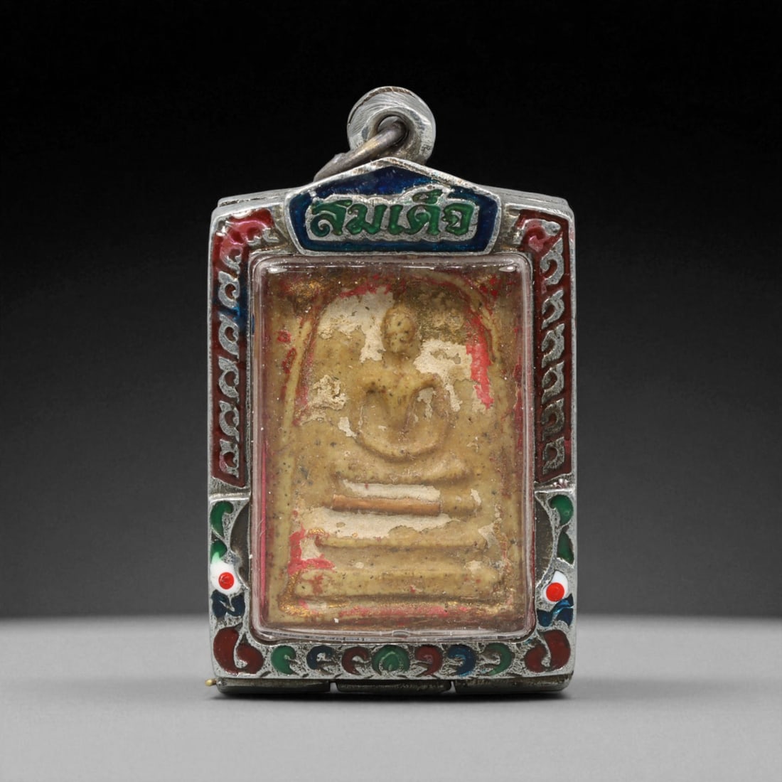 Vintage Thai Buddhist Amulet in Ornate Framed Setting, 20th Century , 5.5cm: This vintage Thai Buddhist amulet exemplifies the devotional artistry that continues to define Thailand's sacred craftsmanship. Encased within an intricately detailed frame, the amulet displays refine
