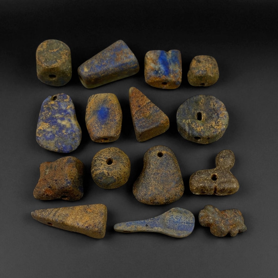 Ancient Bactrian Lapis Lazuli Beads, c. 2nd Millennium BCE, 1-2cm: These ancient lapis lazuli beads originate from the region once known as Bactria, located in present-day northern Afghanistan - a civilization renowned for its early mastery of gemstone craftsmanship 