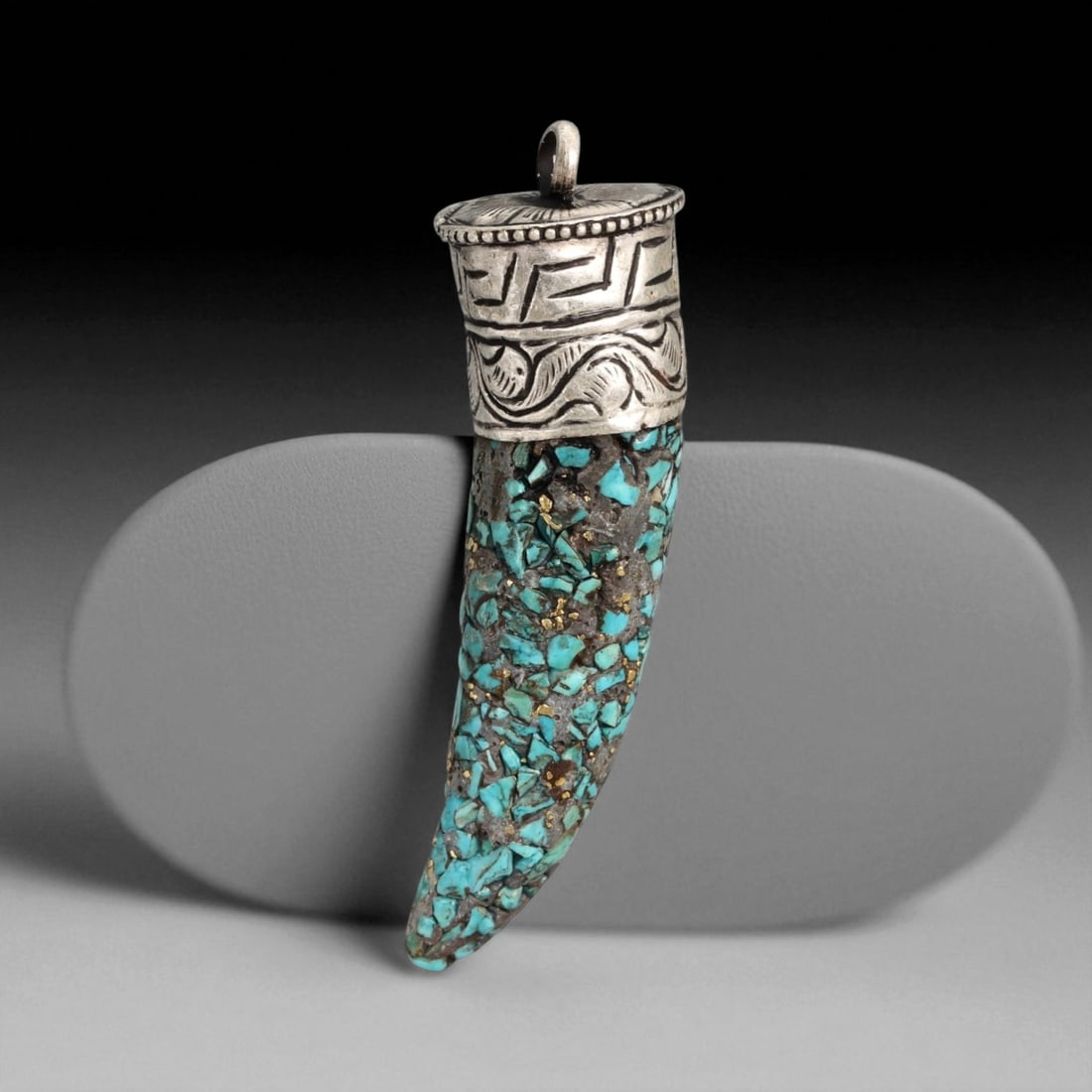 Vintage Himalayan Tibetan Turquoise Inlay Silver Amulet Pendant, 20th Century, 6.6cm: This vintage Himalayan Tibetan pendant takes the form of a protective amulet, crafted with a long tapering body densely inlaid with turquoise fragments. The upper section is capped with a silver mount