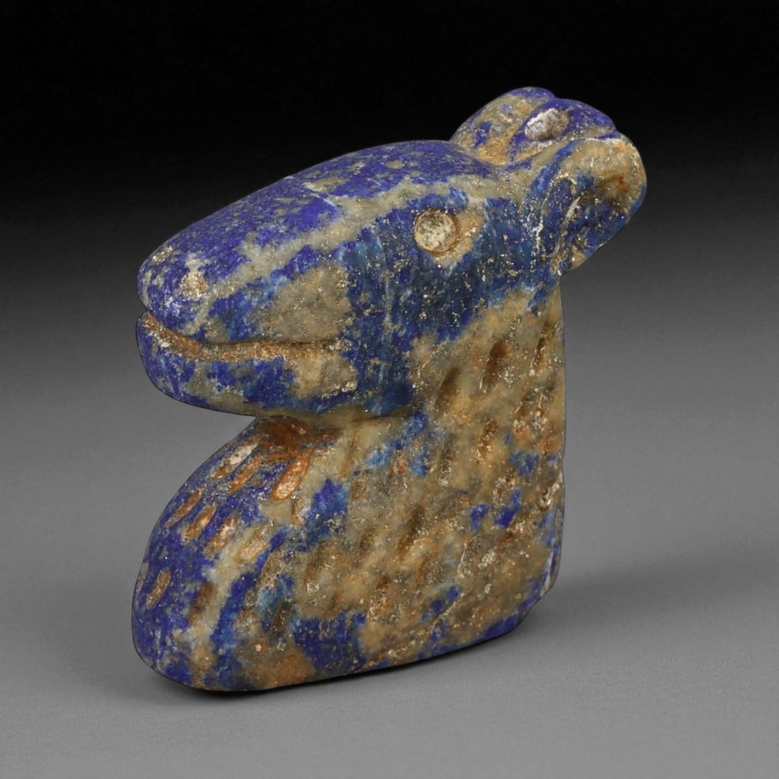 Ancient Bactrian Lapis Lazuli Horse Bust Amulet, c. 2nd-1st Millennium BCE, H 3.5cm: This beautifully carved lapis lazuli horse bust amulet originates from ancient Bactria, circa 2nd-1st millennium BCE - a region celebrated for its mastery of stone carving and for serving as a vital c