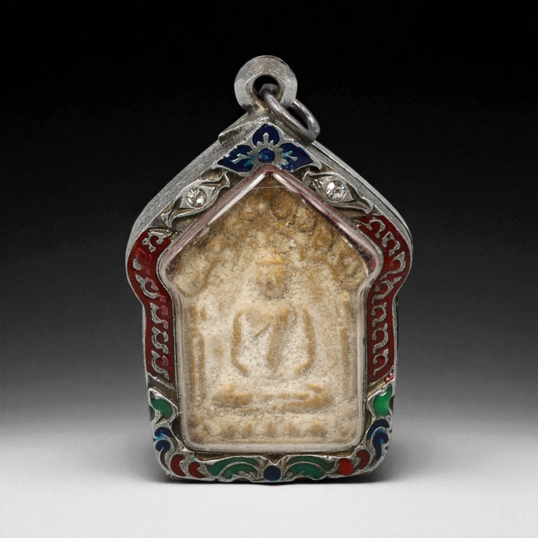 Vintage Thai Buddhist Amulet in Ornate Framed Setting, 20th Century , 5.5cm: This vintage Thai Buddhist amulet exemplifies the devotional artistry that continues to define Thailand's sacred craftsmanship. Encased within an intricately detailed frame, the amulet displays refine