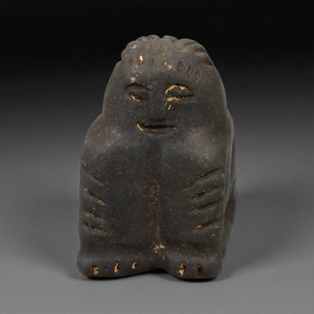 Ancient Elamite Anthropomorphic Stone Amulet, c. 3rd-2nd Millennium BCE 3.8 cm: This small yet powerful anthropomorphic amulet, carved from dark stone and measuring 3.8 cm in height, originates from the Elamite civilization of southwestern Iran. Compact and minimalist, the figure
