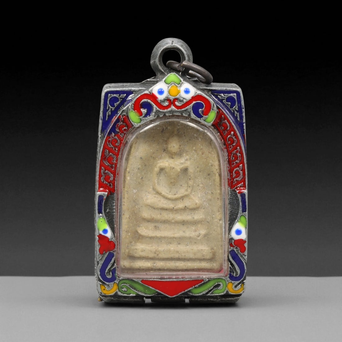 Vintage Thai Buddhist Amulet in Ornate Framed Setting, 20th Century , 5.5cm: This vintage Thai Buddhist amulet exemplifies the devotional artistry that continues to define Thailand's sacred craftsmanship. Encased within an intricately detailed frame, the amulet displays refine