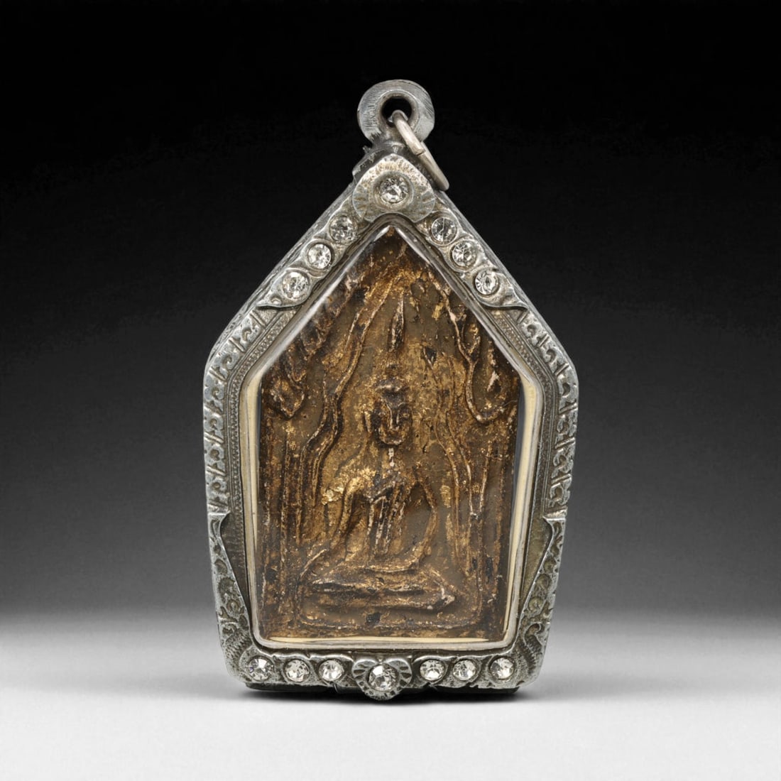 Vintage Thai Buddhist Amulet in Ornate Framed Setting, 20th Century , 6cm: This vintage Thai Buddhist amulet exemplifies the devotional artistry that continues to define Thailand's sacred craftsmanship. Encased within an intricately detailed frame, the amulet displays refine