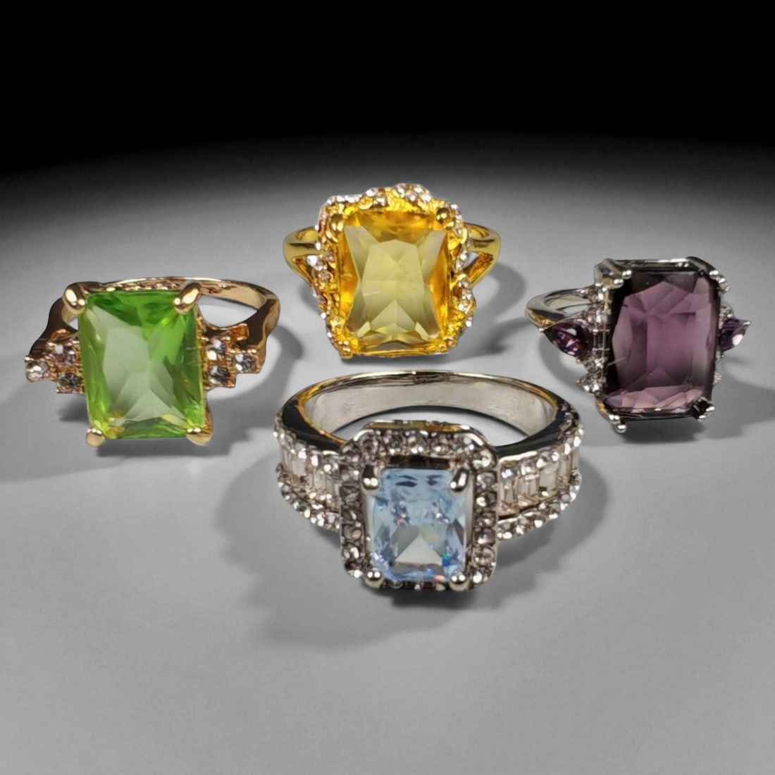 Lot of 4 Vintage and Contemporary Fashion Ring Lot, c. 20th-21st Century: This assorted lot of vintage and contemporary fashion rings offers a vibrant collection of statement pieces showcasing diverse styles, materials, and craftsmanship. Designed for decorative wear rather