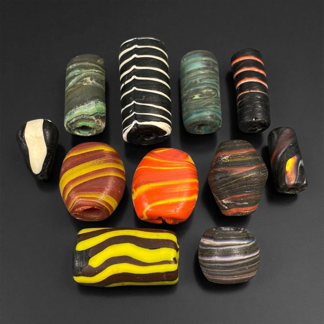 Antique Venetian Polychrome Millefiori and Chevron Glass Beads, c. 19th Century, 1.6-3.4cm: This lively assemblage of antique Venetian glass beads, dating from the 19th century, captures the exuberant color and artistry that made Murano glassmakers the undisputed masters of decorative beadwo