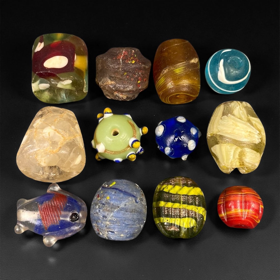 Antique Venetian Polychrome Millefiori and Chevron Glass Beads, c. 19th Century, 1.2-2.1cm: This lively assemblage of antique Venetian glass beads, dating from the 19th century, captures the exuberant color and artistry that made Murano glassmakers the undisputed masters of decorative beadwo