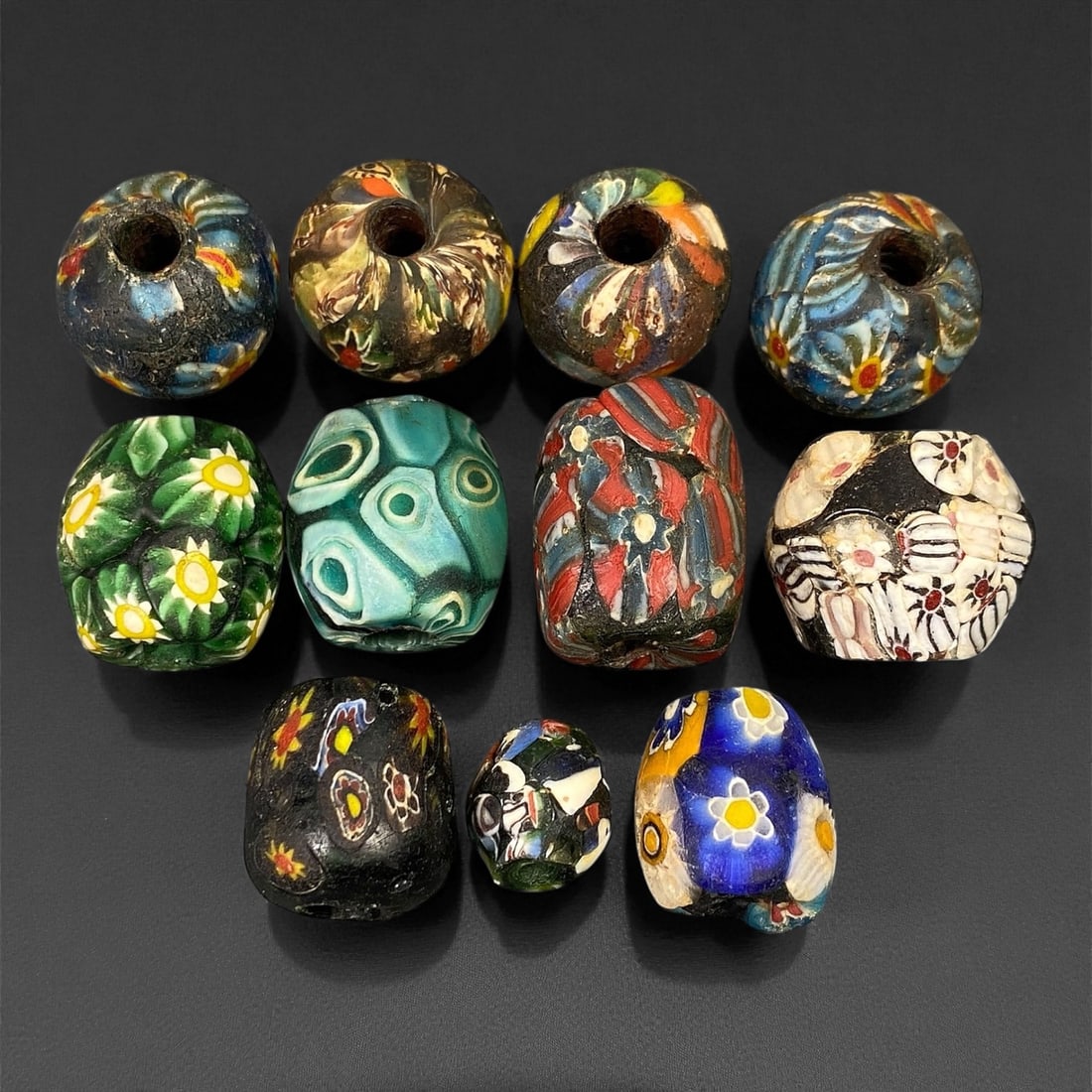 Antique Venetian Polychrome Millefiori and Chevron Glass Beads, c. 19th Century, 1.5-2.5cm: This lively assemblage of antique Venetian glass beads, dating from the 19th century, captures the exuberant color and artistry that made Murano glassmakers the undisputed masters of decorative beadwo