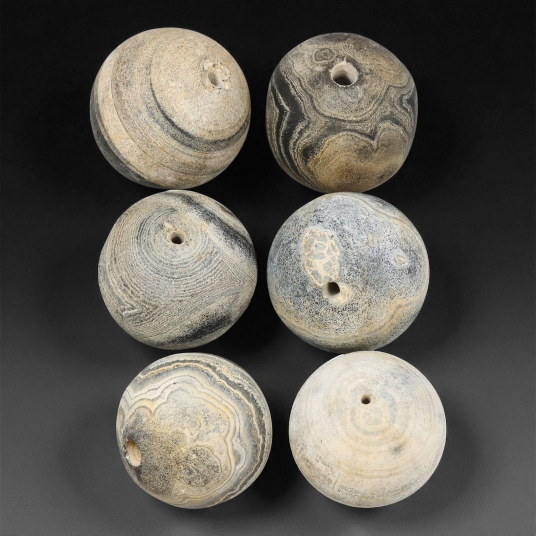 Antique Tibetan Grey Banded Agate Prayer Beads Collection, c. 18th-19th Century, 2-2.2 cm: This refined collection of antique agate beads, dating to the 18th-19th century, originates from the Tibetan Himalayan region. Each bead is beautifully shaped and hand-drilled from naturally banded ag
