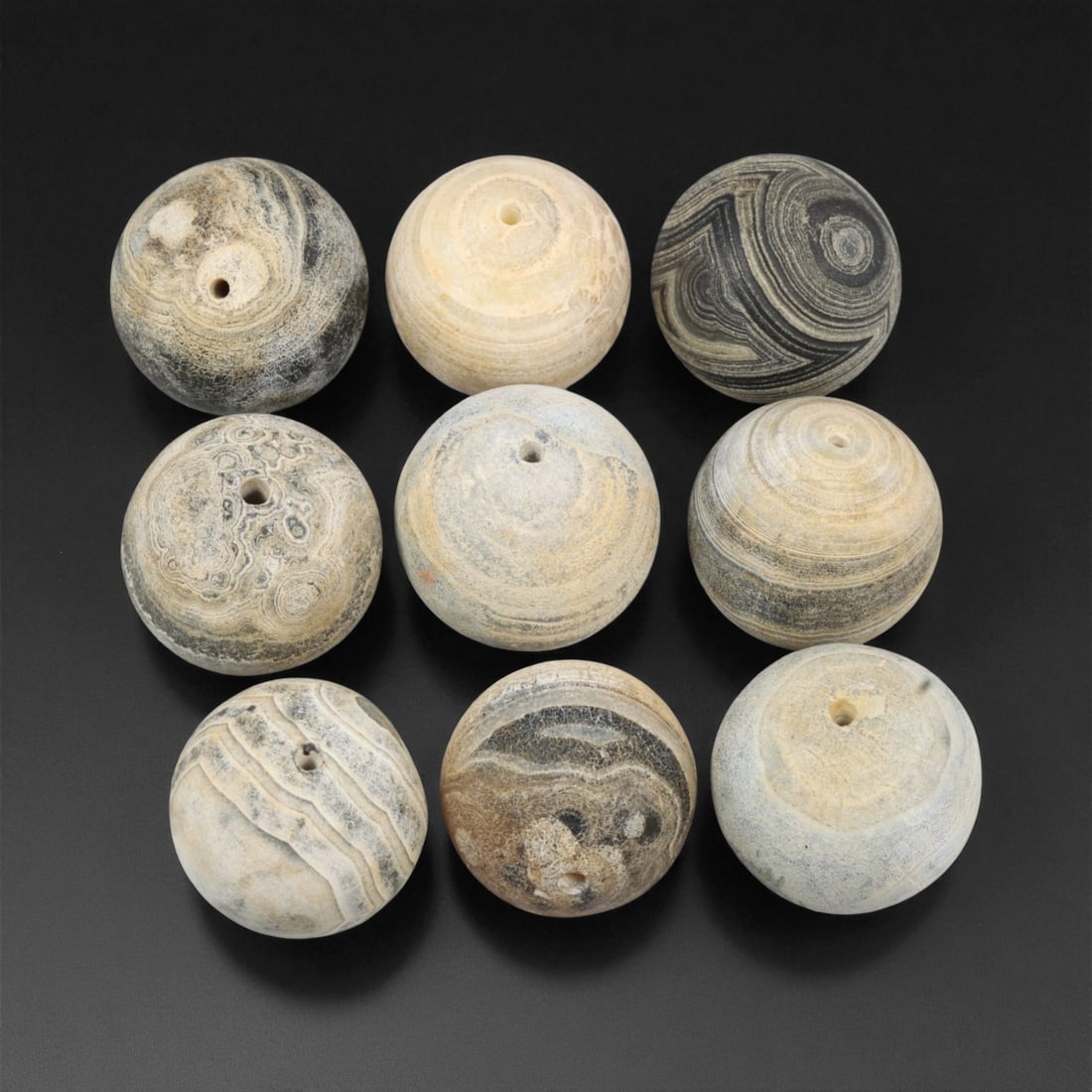 Antique Tibetan Grey Banded Agate Prayer Beads Collection, c. 18th-19th Century, 1.9cm: This refined collection of antique agate beads, dating to the 18th-19th century, originates from the Tibetan Himalayan region. Each bead is beautifully shaped and hand-drilled from naturally banded ag