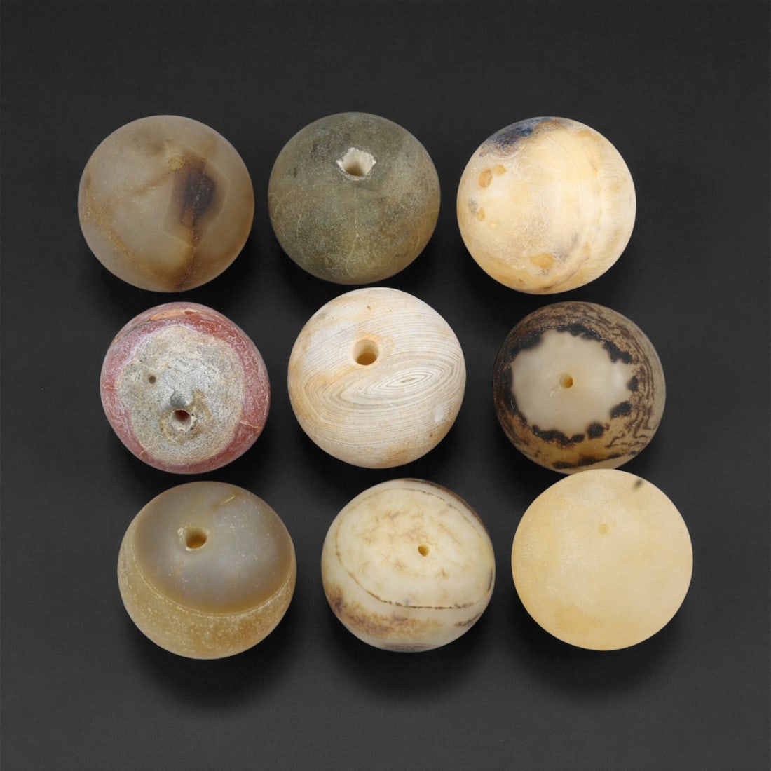 Antique Tibetan Grey Banded Agate Prayer Beads Collection, c. 18th-19th Century, 1.7cm: This refined collection of antique agate beads, dating to the 18th-19th century, originates from the Tibetan Himalayan region. Each bead is beautifully shaped and hand-drilled from naturally banded ag