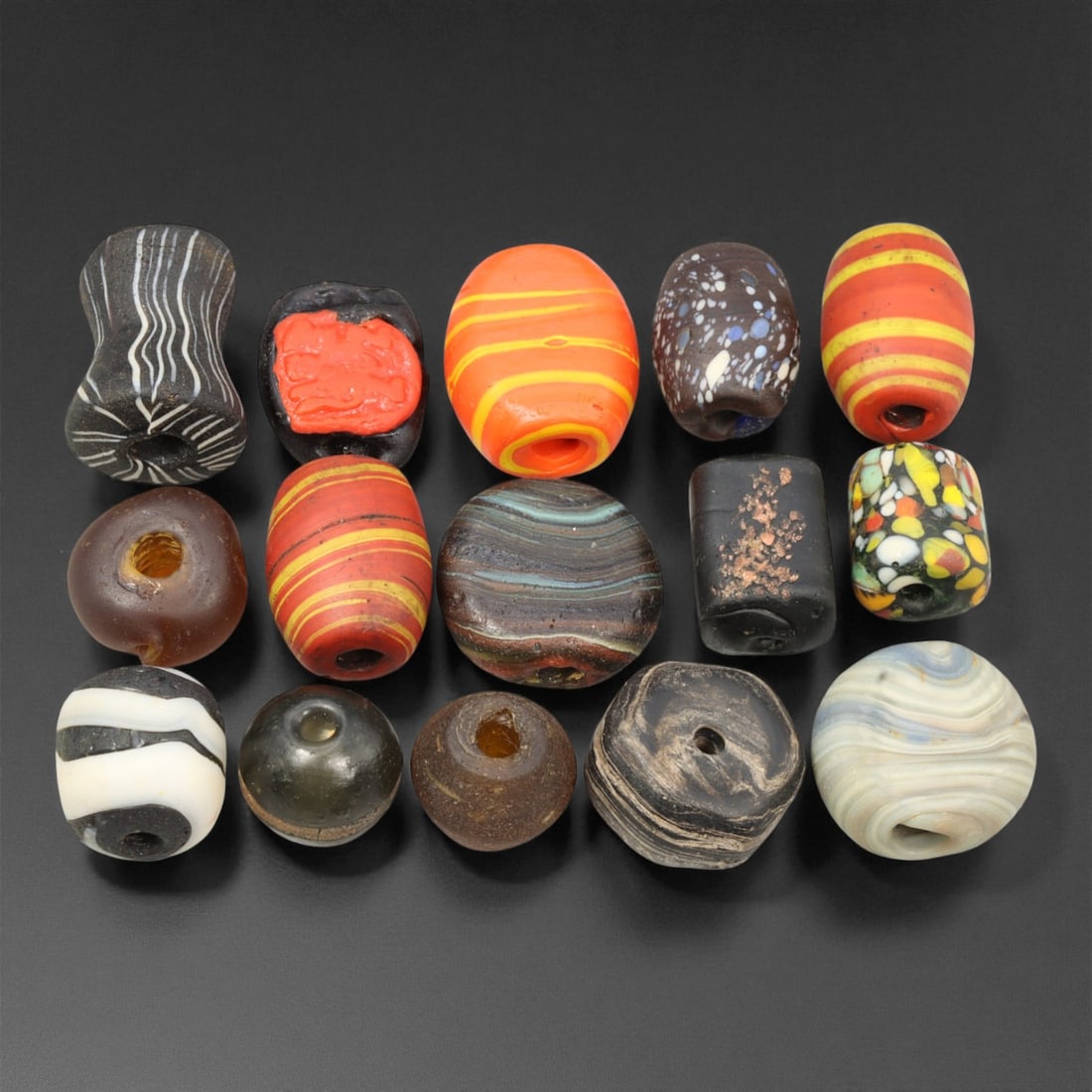 Antique Venetian Millefiori Glass Trade Beads, c. 19th Century, 1.3-2cm: This vibrant assemblage of antique Venetian glass beads captures the height of Murano's decorative artistry during the 19th century. Created using the millefiori and chevron techniques, these beads ex