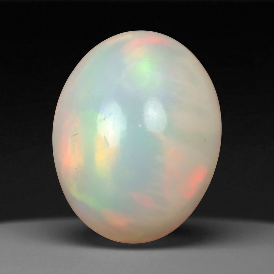 2.50 Carats Multi-Color Welo Opal Lot - Natural Ethiopian Stones: This radiant group of Welo opals displays a mesmerizing interplay of color that dances across the surface with every shift of light. Electric flashes of green, orange, and red ripple through a translu