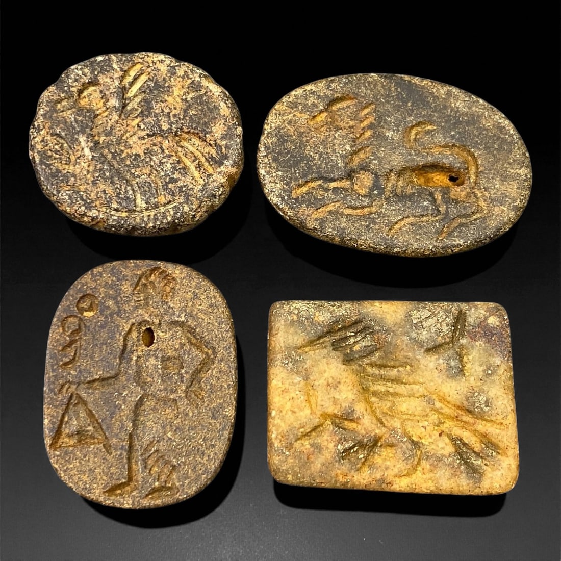 Ancient Parthian-Babylonian Steatite Animal and Deity Stamp Seals, c. 1st Century CE 2.4-3.1cm: This compelling group of four ancient double-convex stamp seal beads, carved from steatite, dates to the transitional Parthian-Babylonian period, c. 2nd century BCE to 1st century CE. These seals illu