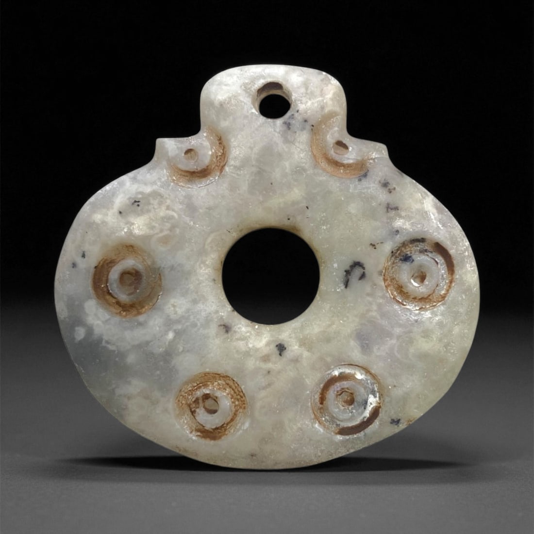 Ancient Persian Chalcedony Solar Amulet, c. 800-500 BCE 3.5cm 13g: This beautifully carved chalcedony amulet, weighing 13 grams and measuring 3.5 centimeters in diameter, originates from the early Achaemenid or pre-Achaemenid Persian period, c. 800-500 BCE. Such amul