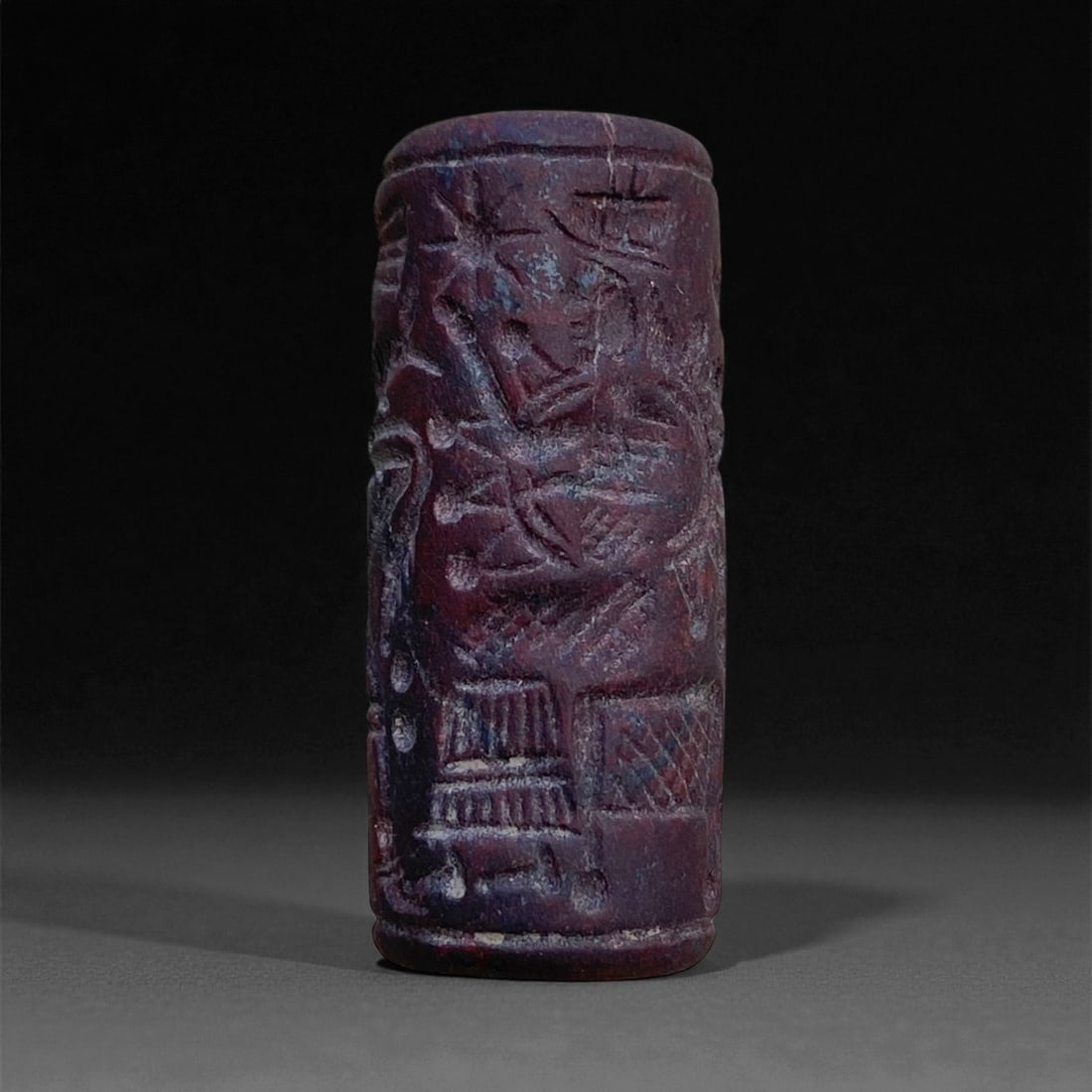 Ancient Akkadian Cuneiform Jasper Cylinder Seal, c. 23rd-22nd Century BCE, 4cm, 14g: This remarkable cylinder seal originates from the Akkadian Empire, the first known empire in human history, flourishing in Mesopotamia around 2334-2154 BCE. Carved from deep reddish-purple jasper, the